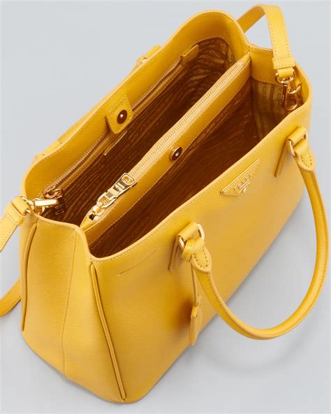 she's rocking yellow prada tote|designer Prada totes.